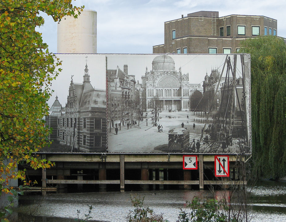 A billboard on the canal publicizes Amsterdam's renovation plans.