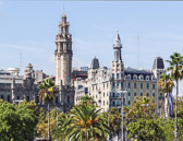 View across the park by Port Vell with splendid architecture as a backdrop.