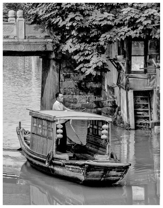 Canal transportation is one way to get around the city of Suzhou China.
