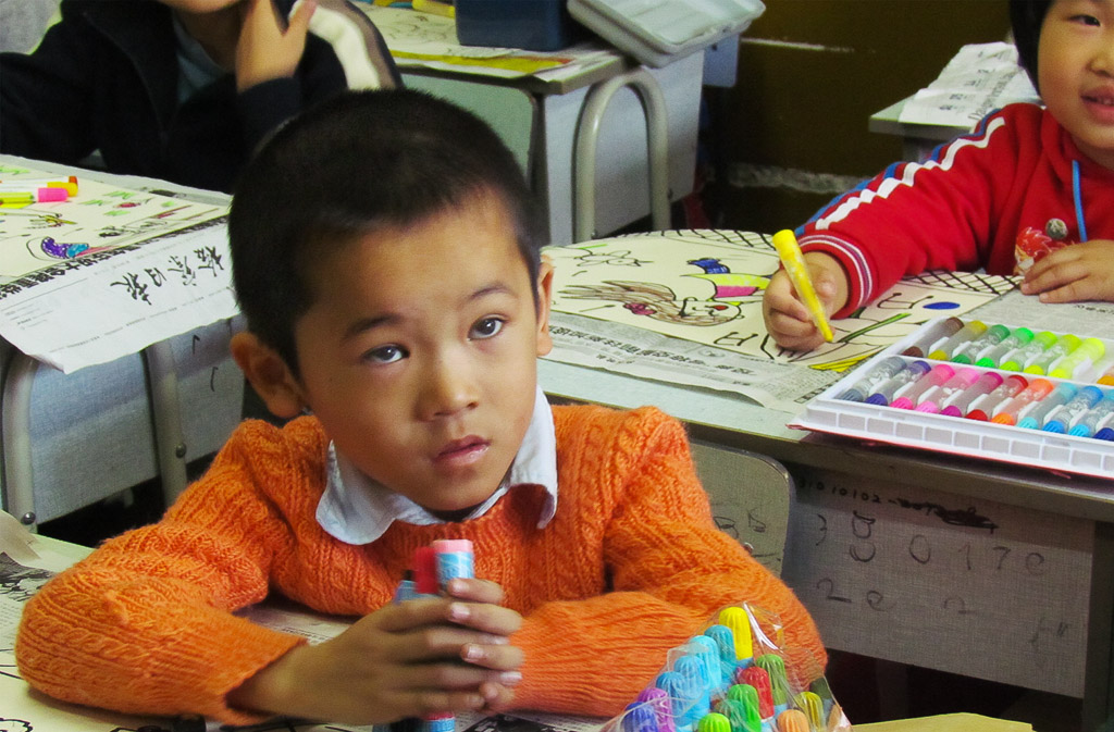 A visit to a Shanghai school where this student tries to figure out the hat.