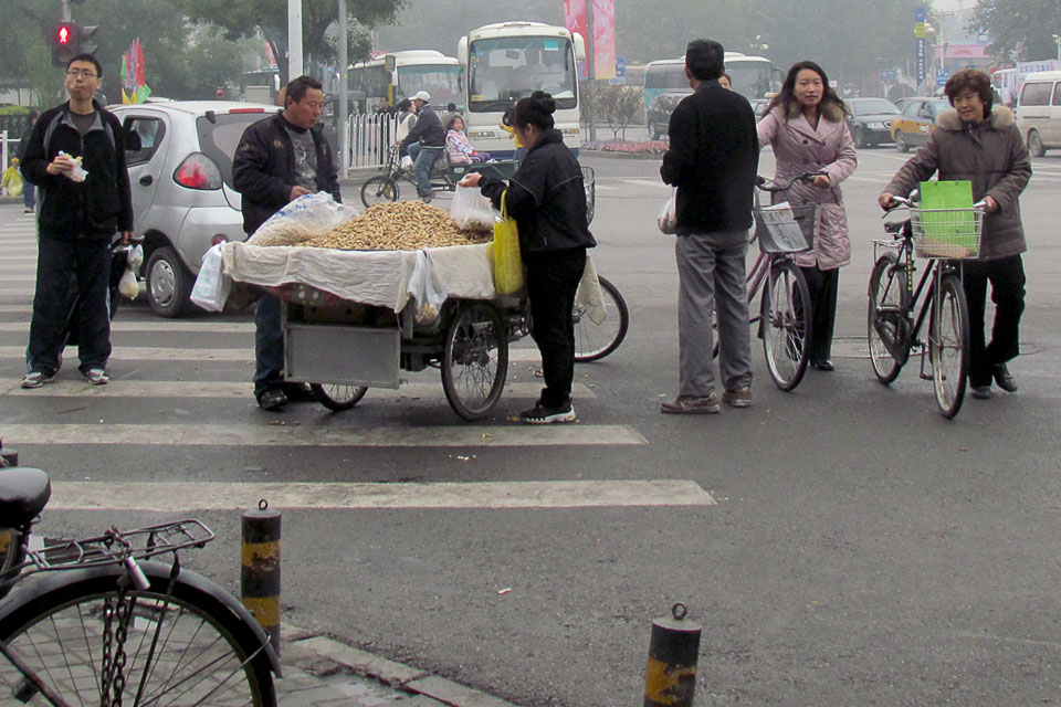 Vendors set up right in the middle of busy Beijing streets.