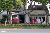 We walk the main road from the train station into Suzhou's busy city center.