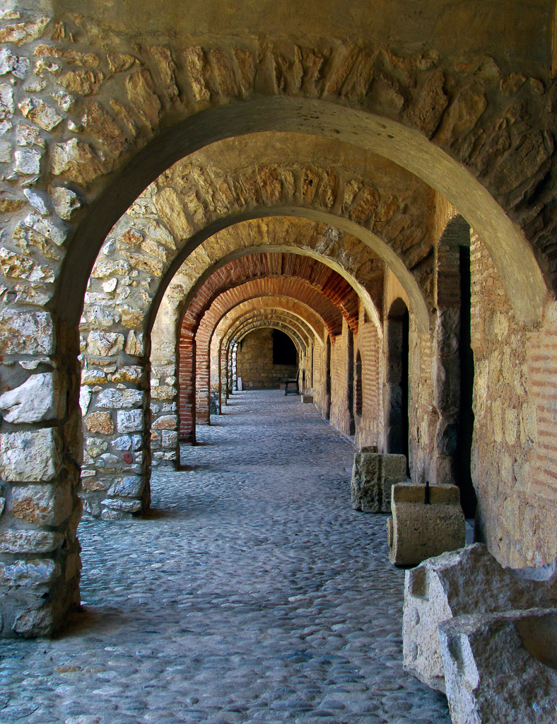 Walking through the arches at the Fortress Salses near Leucate.