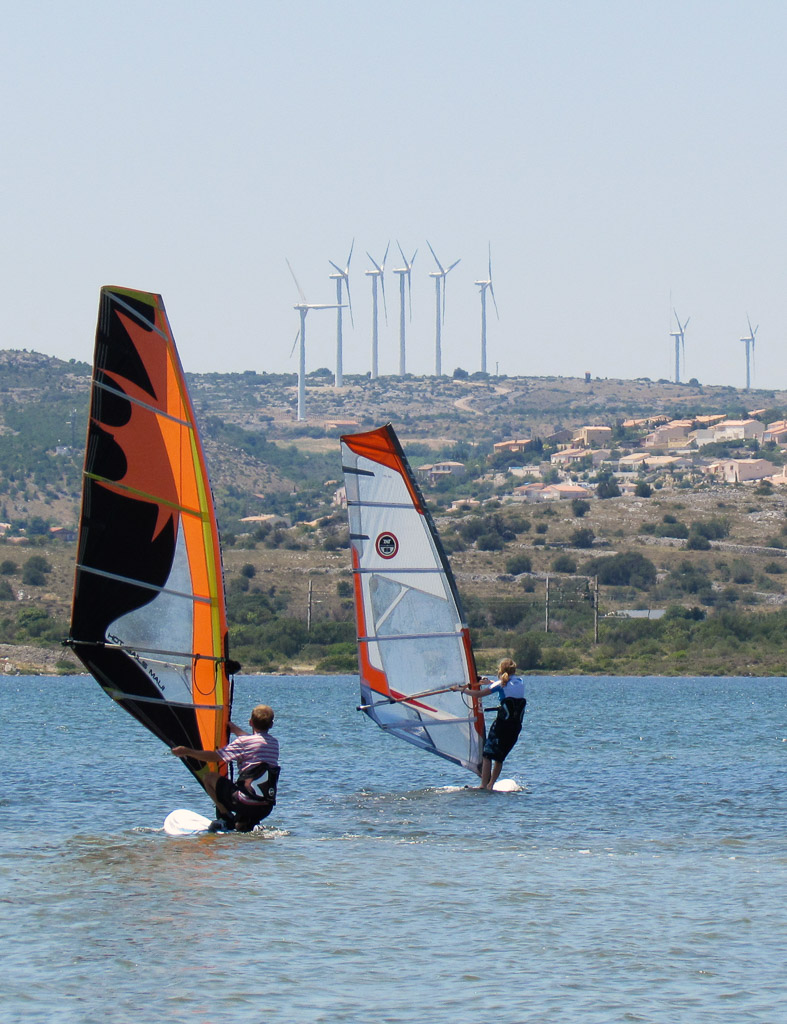 Two ways to put wind power to work in Leucate, a hot spot  for wind surfers.