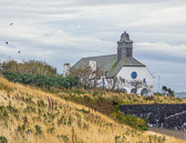 A view of a church situated at the entrance to the Giant's Causeway.