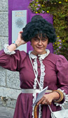 This Galway street performer assumes a persona of the late 1800's but her wrist watch gives her away.