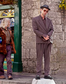 Galway on Sunday has many colorful street performers although this one seems to need a nap.