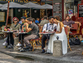 This couple celebrates their wedding at a Montmartre sidewalk cafe.