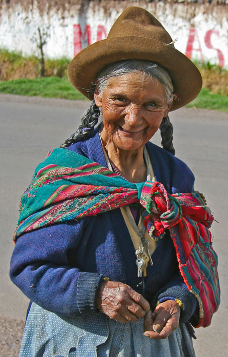 An old woman happily greets both us and the day early in the morning in Yucay.