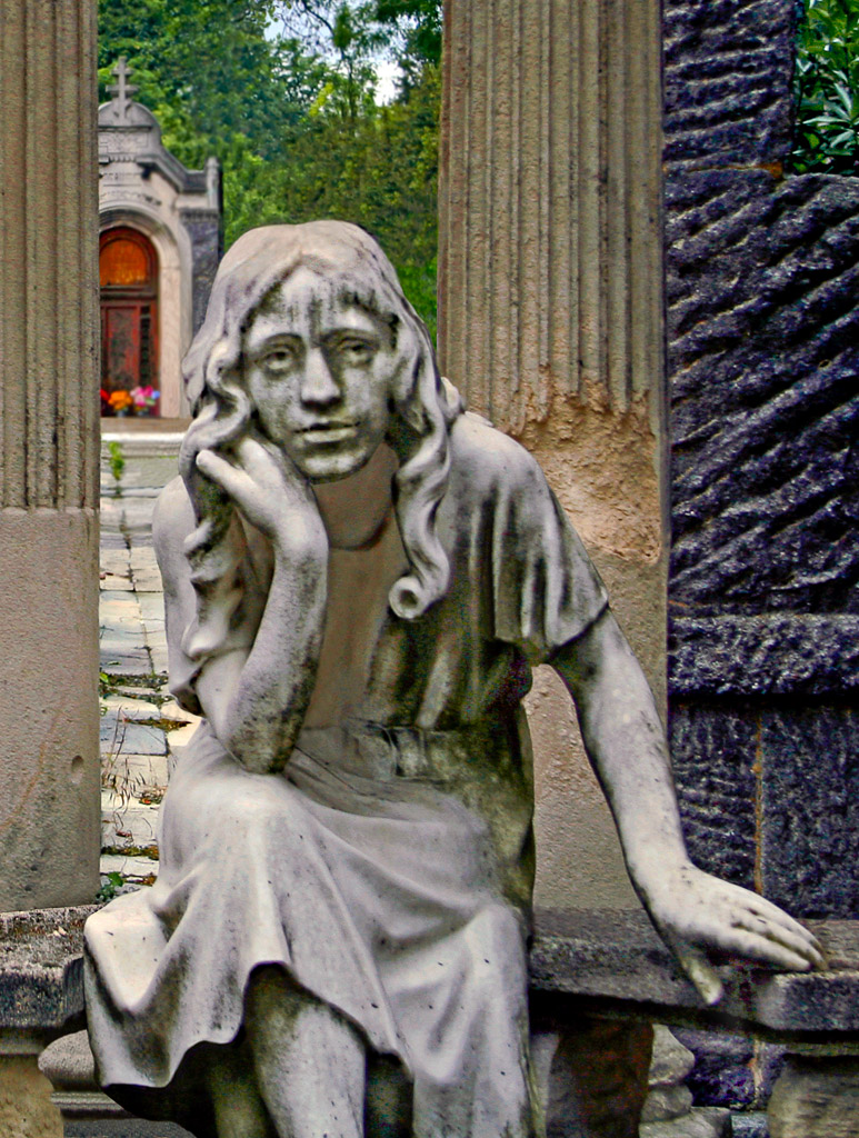 She sits in sadness in the Montmartre Cemetery in Paris.