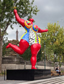A Niki de Saint Phalle sculpture between the tower and the Seine.
