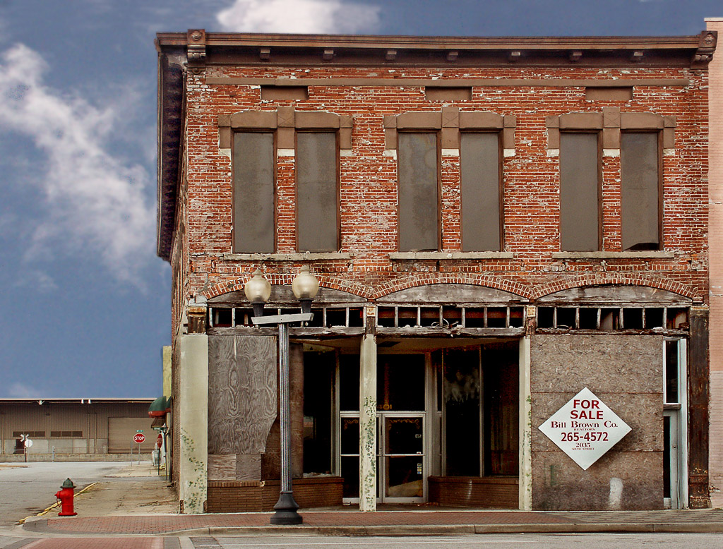 An abandoned building reminds us of the ecay of many American cities.