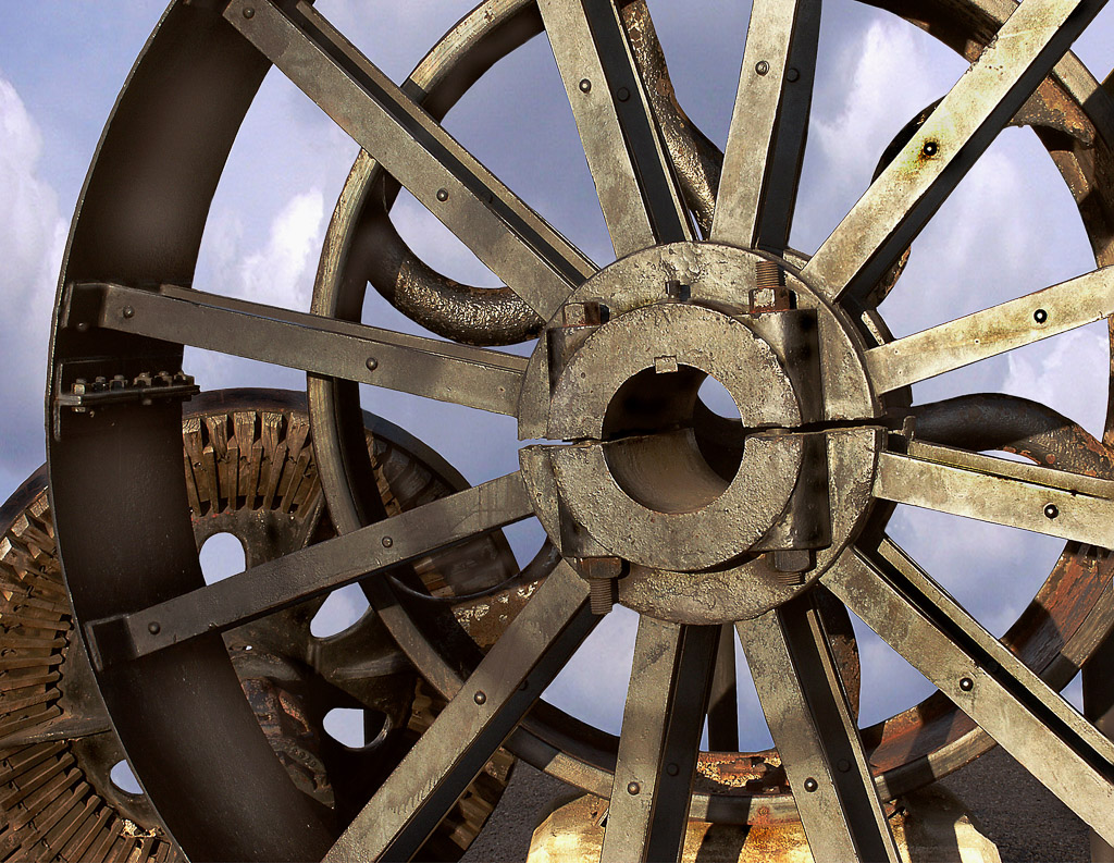 An antique cast iron wheel in Richmond, Virginia along the James River.