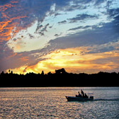 Fishermen head home before sunset on the Halifax River, Port Orange, Fl.