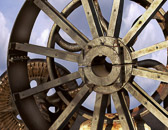 An antique cast iron wheel in Richmond, Virginia along the James River.